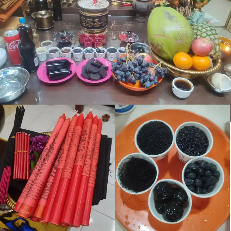 Red inscribed Rahu candles with black offerings, fruits and ceremonial items prepared for Phu Lersi Techo’s Rahu ritual.