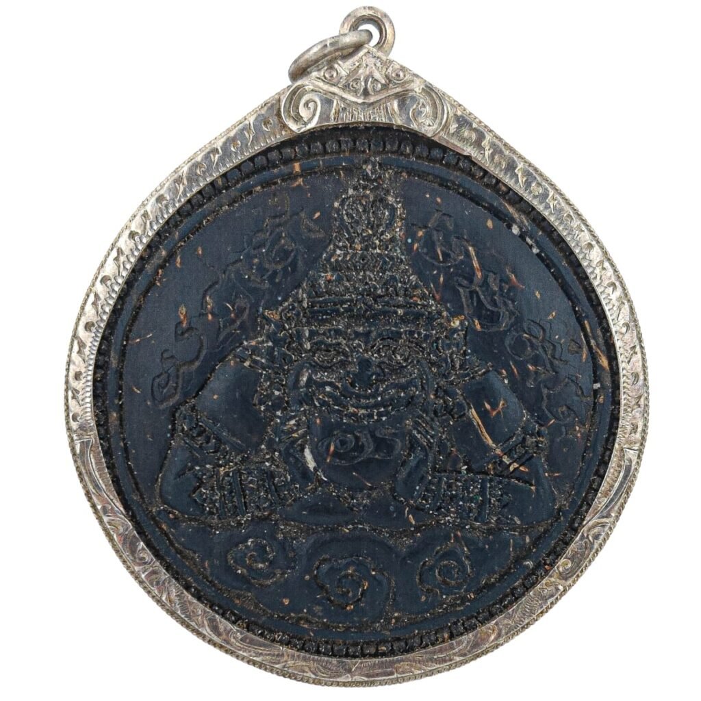 Twin one eye coconut shell rahu in silver frame by puu lersi pong