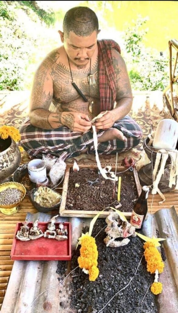 Ajarn Tom making amulet