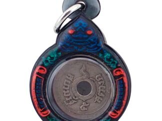 Close-up of 100-year burial corpse coin amulet from Ajarn Tom, early 1900s Thai coin with Chakra mark used for wealth and luck
