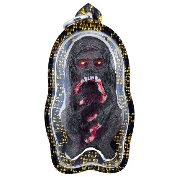 Hakom Phi Phong amulet front view showing black ghoul figure with red detailing and protective waterproof casing