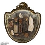 Prai Phra Pirab amulet back view showing prai materials and sacred composition