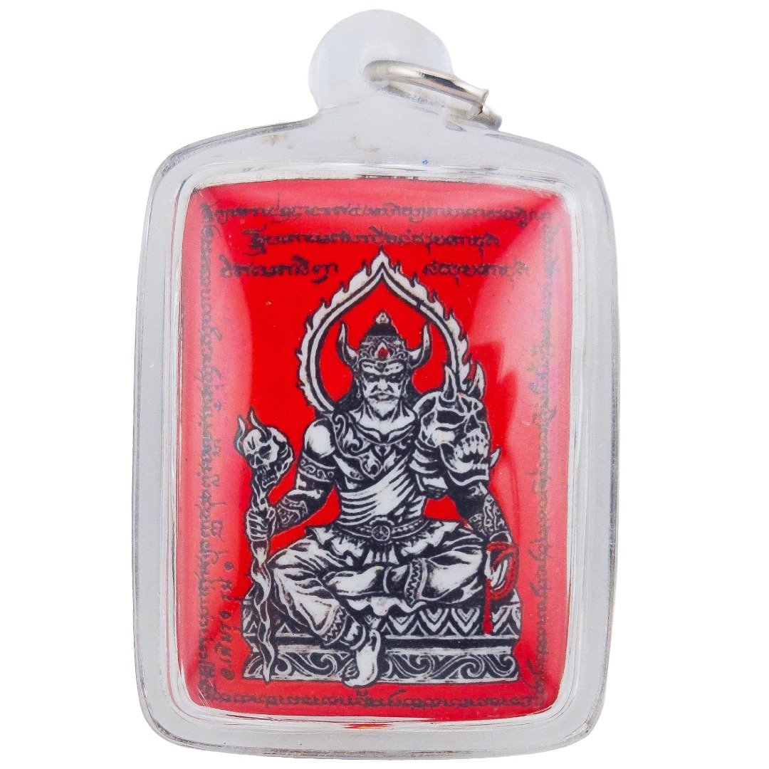 Phaya Yom Maharaj amulet front view depicting Phaya Yom seated on a throne with sacred yant inscriptions on a red background