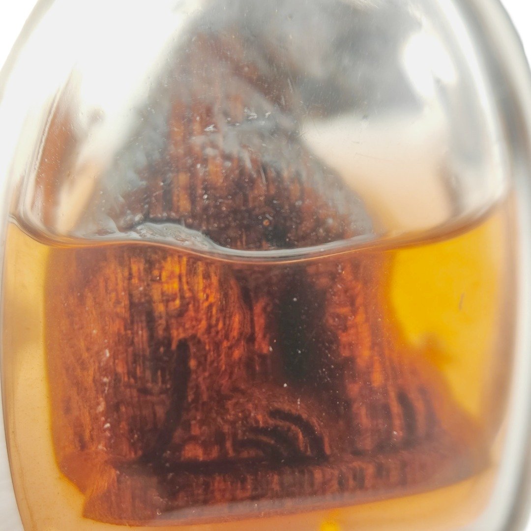 Close-up detail of the Lightning-Struck Mai Makaam Maa Kin Kwaam Kit showing the natural wood grain and Nam Man Maa Kin Kwaam Kit.
