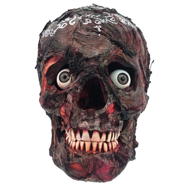 Front view of the Ritual Prai Skull showing both eyes, teeth, weathered ritual finish and white yants on top.