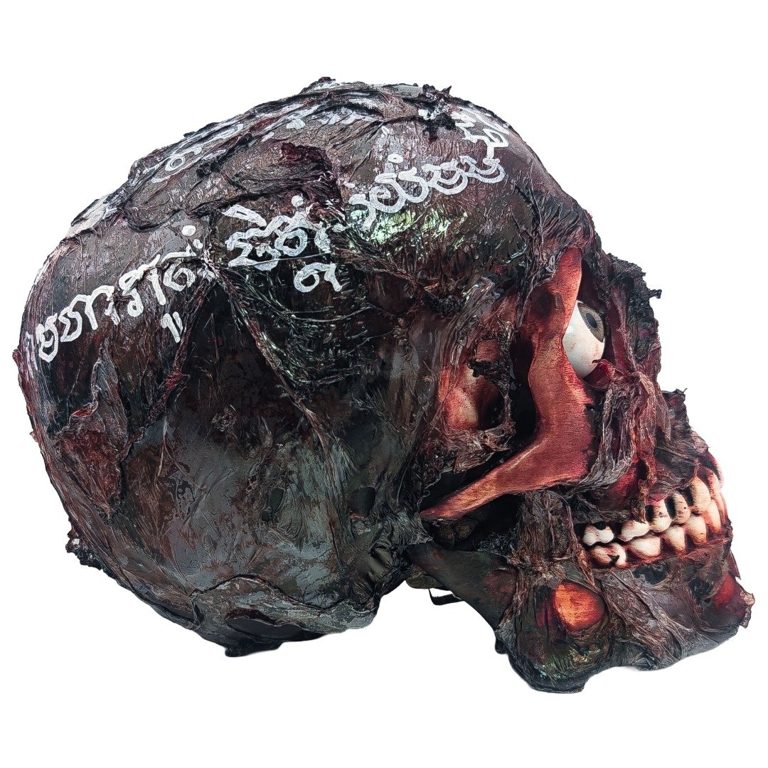 Right side view of the Ritual Prai Skull showing white yants, dark skull texture, eye detail and teeth.