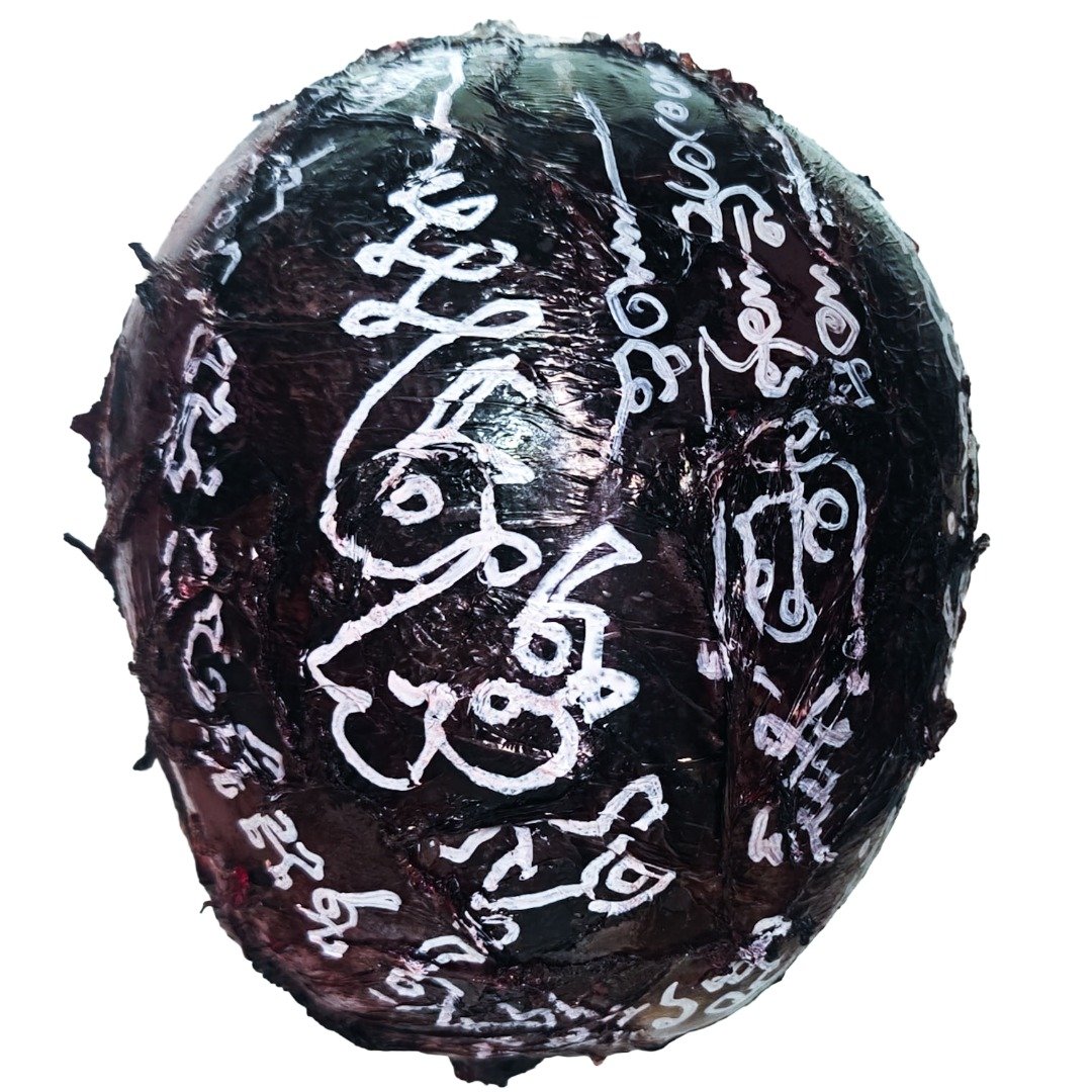 Top view of the Ritual Prai Skull with white yants drawn across the dark weathered skull surface.
