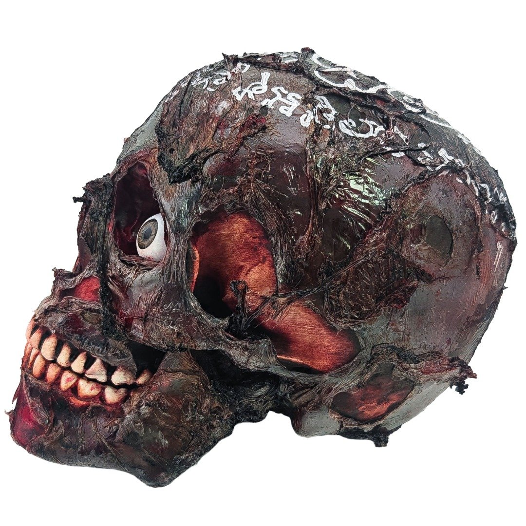 Side view of the Ritual Prai Skull showing eye detail, teeth, dark ritual texture and yants across the skull.