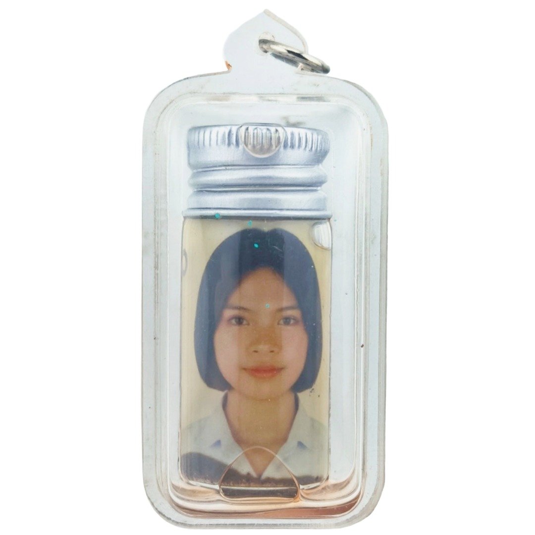 Front view of Nong Phet Wanisa Nam Man Prai oil bottle with portrait inside clear casing