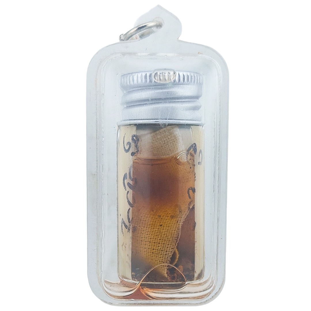 Back view of Nong Phet Wanisa Nam Man Prai oil bottle showing cloth and oil inside the clear casing