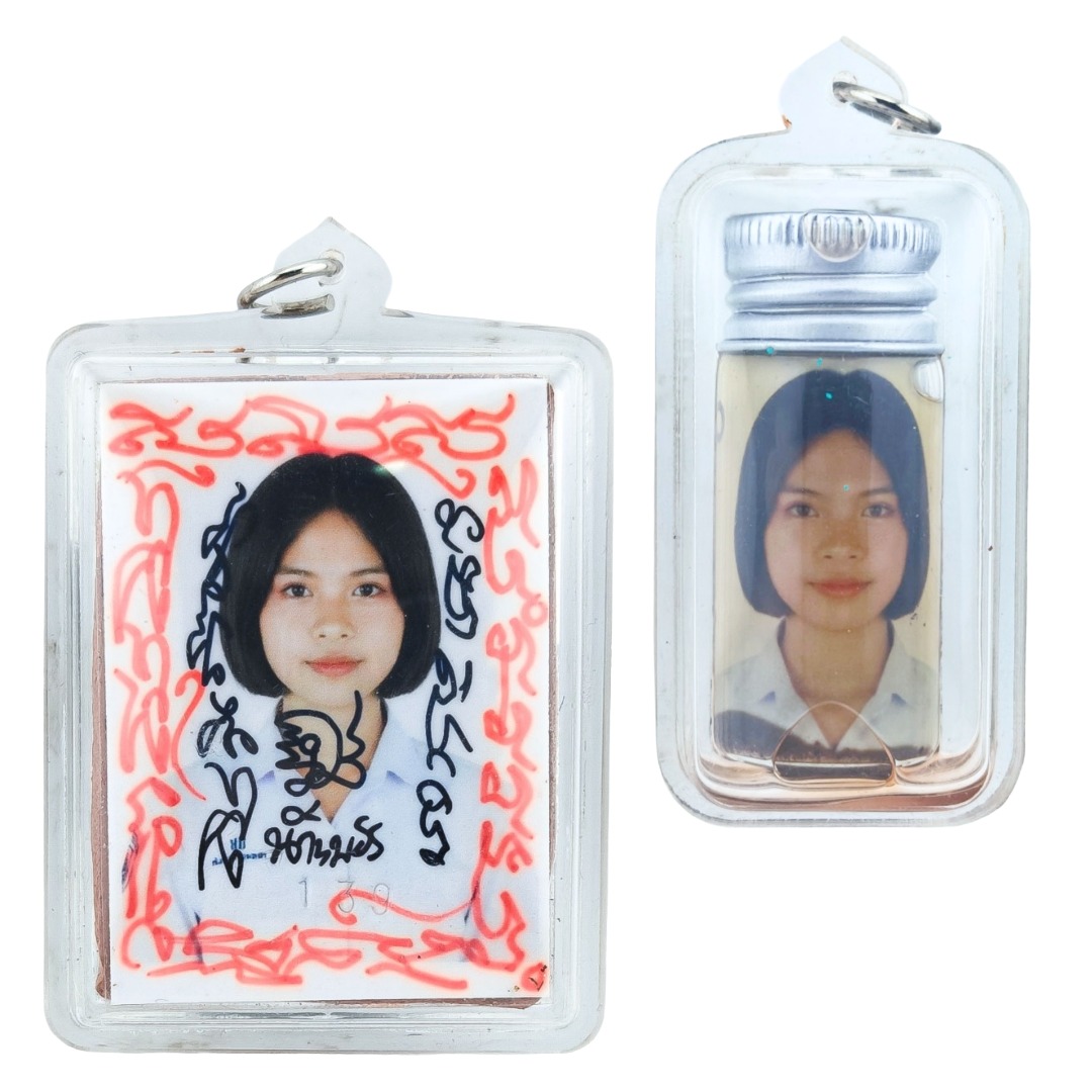 Nong Phet Wanisa locket and Nam Man Prai oil bottle shown together in clear protective casing
