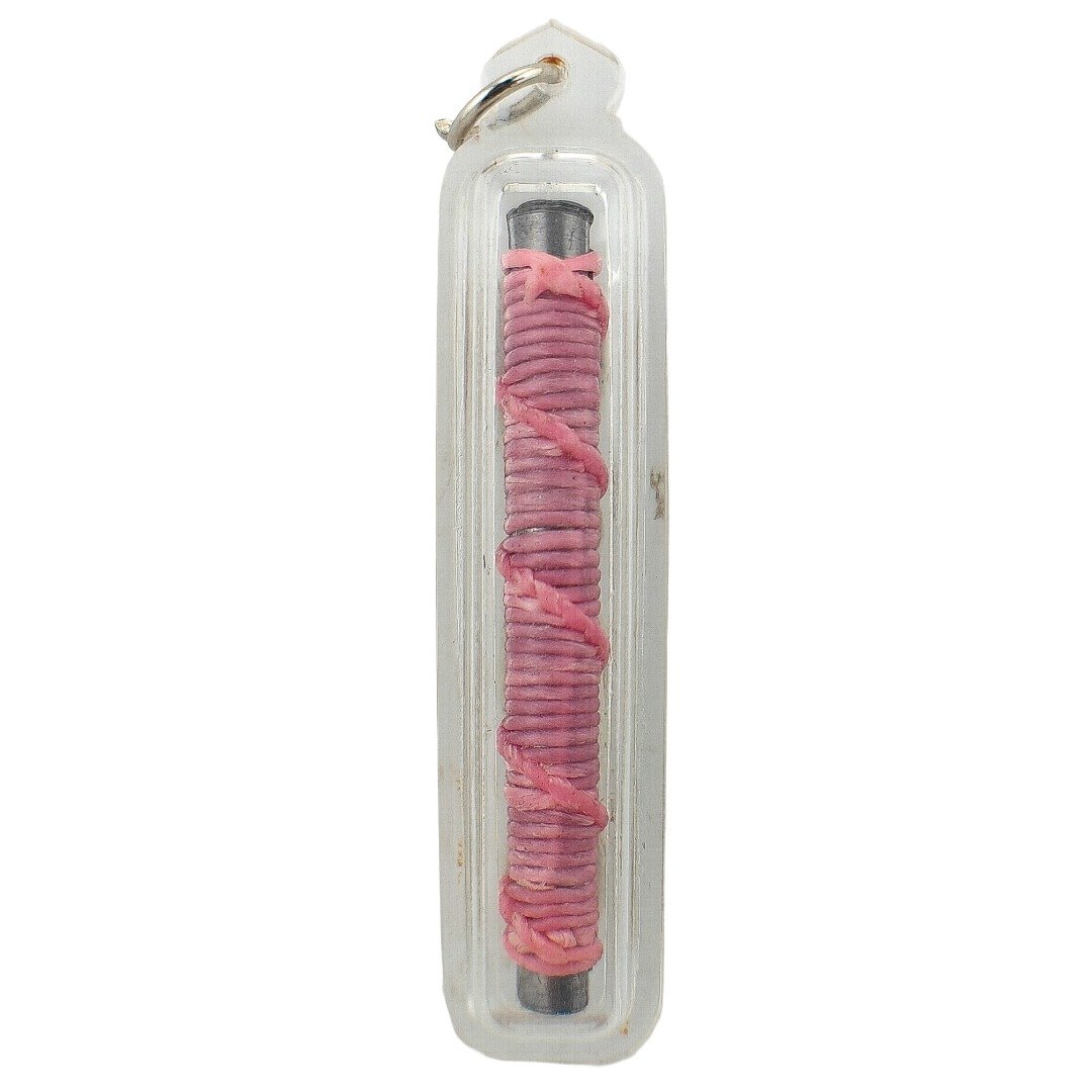 Takrut Bua Bang Bai Na Ok Tek main view in clear casing with pink cord wrapping