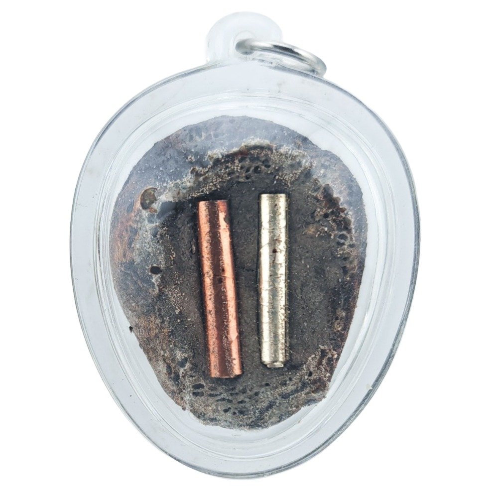 Prai Kasip Gradook Khaen back view showing silver and copper takruts sealed behind the amulet