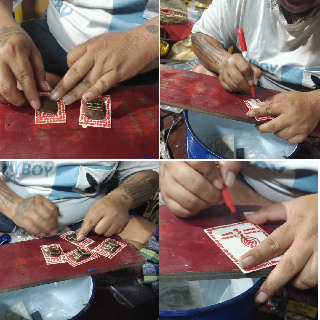 Maker attaching relic materials and writing red yants on the backing cards used for the Mae Prai SaengDao amulets.