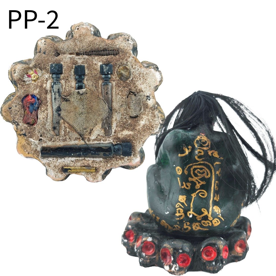 Rear and underside view of Phi Pong Bucha PP-2, showing the gold yant, sealed bottles and materials beneath the base.