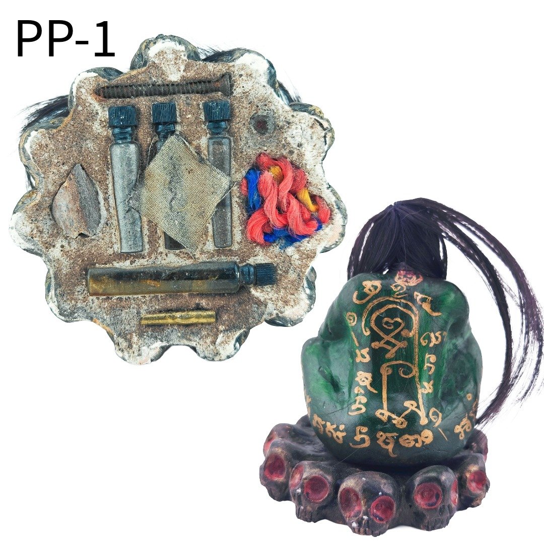 Rear and underside view of Phi Pong Bucha PP-1, showing the gold yant and occult materials placed beneath the base.