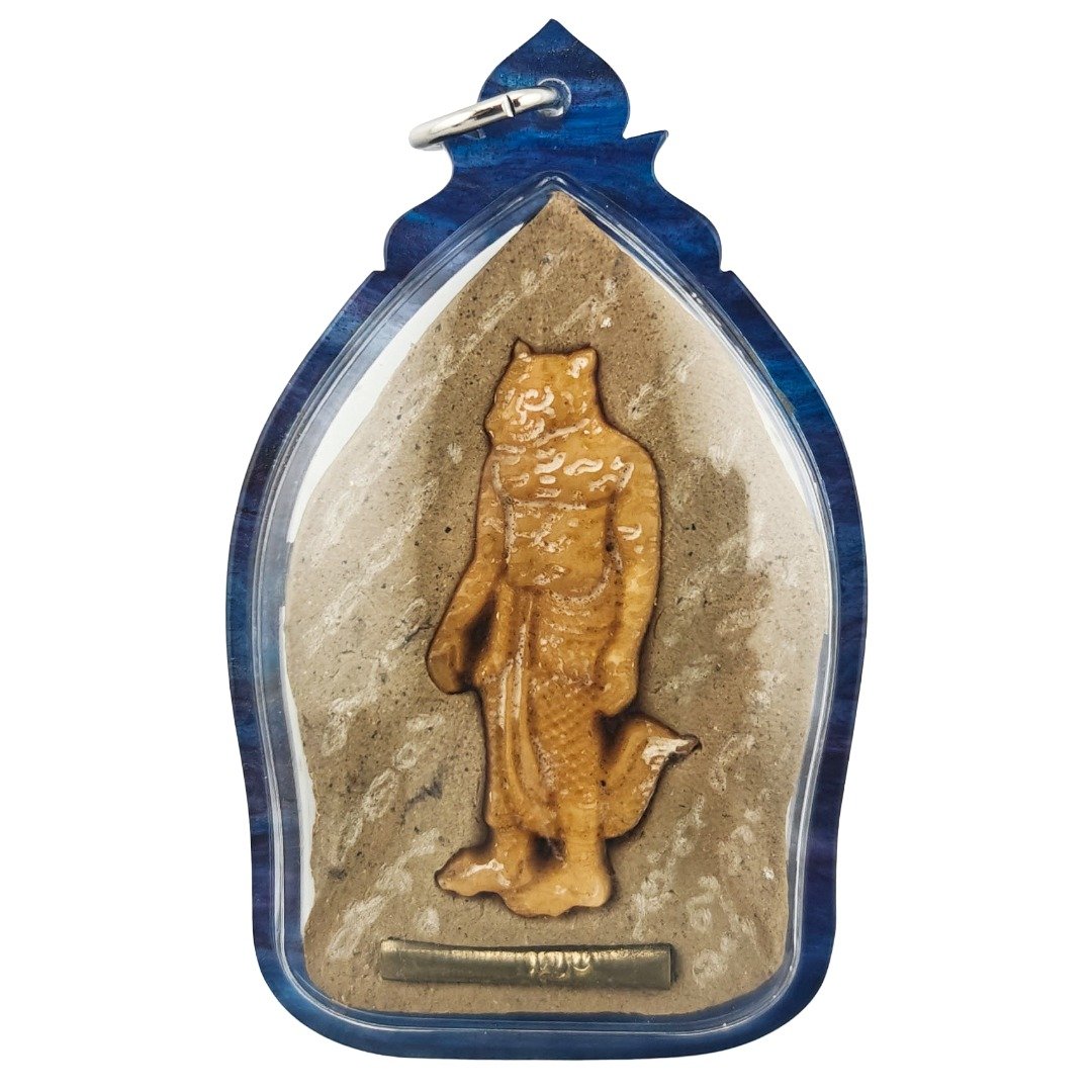 Back of the blue-cased Phra Lersi Kobut special pim showing the carved Lersi Sermingpai figure, takrut below and hand-engraved yants.