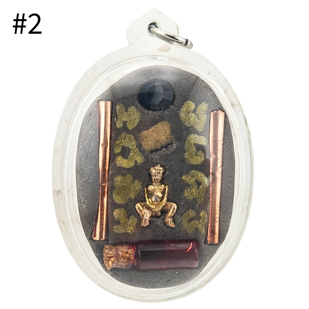 Back of Por Per Panneng Prai Piece #2 by Ajarn Nut, showing murn sarn, two takruts, miniature Por Per and Nam Man Prai Saneha.