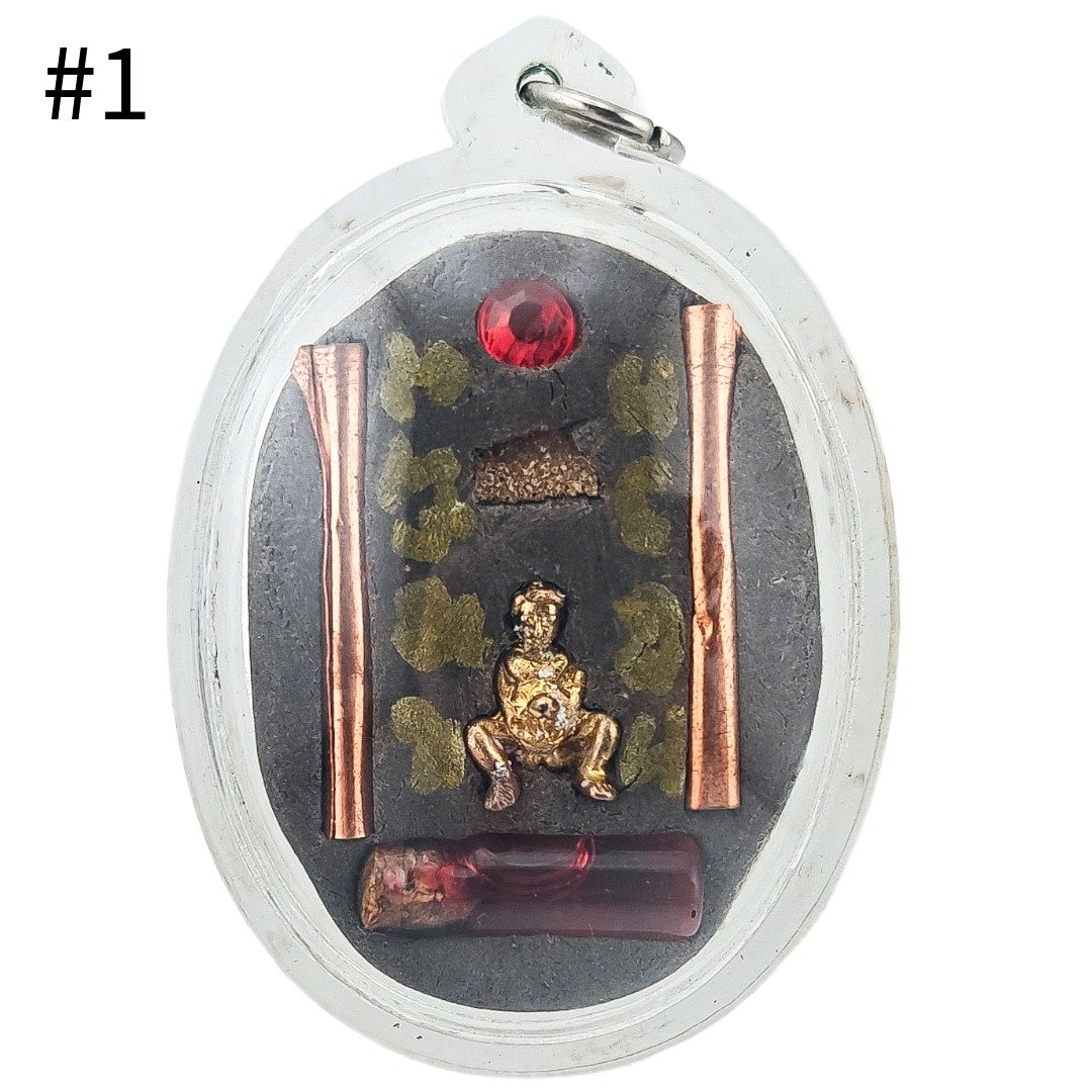Back of Por Per Panneng Prai Piece #1 by Ajarn Nut, showing murn sarn, two takruts, miniature Por Per and Nam Man Prai Saneha.