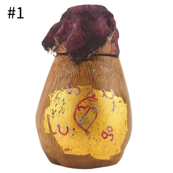 Front of Mini Hakom Bang Fai Zum #1 with gold leaf, red yants and corpse cloth covering the cap.