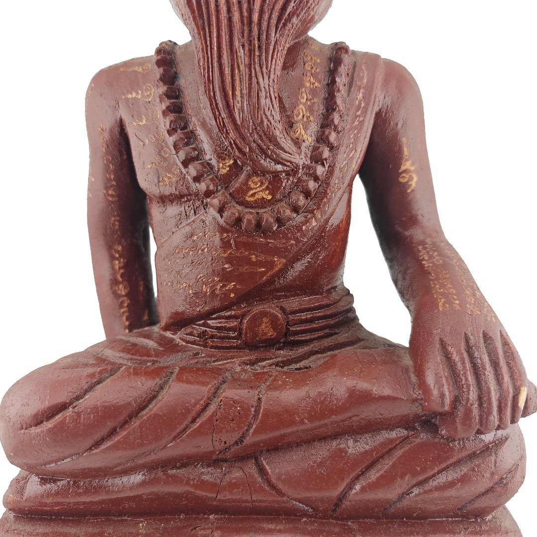 Close up of aged hand engraved yants on Lersi Sermingpai Bucha