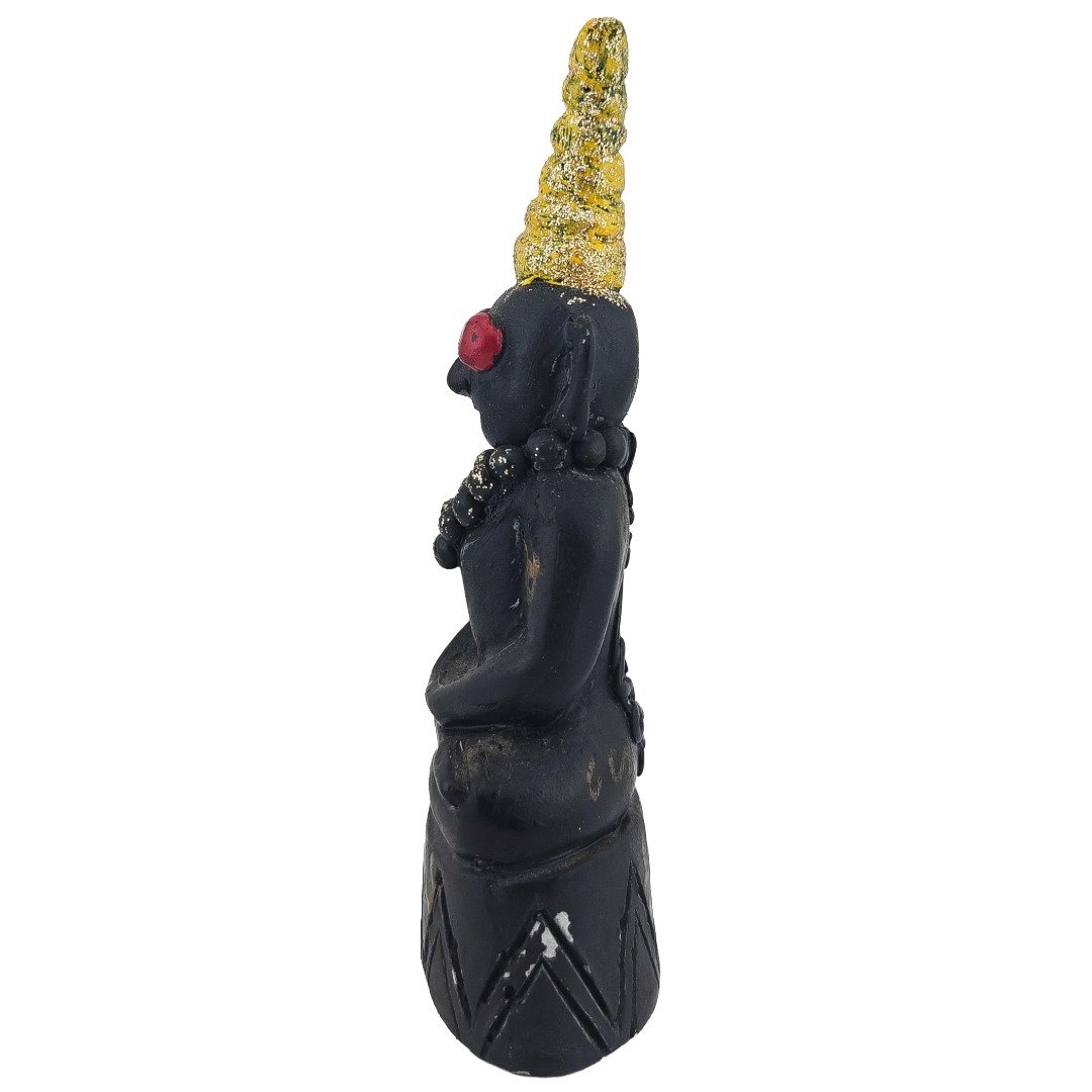 Side view of the old Ajarn Put Casanova Ngan with black body and gold crown