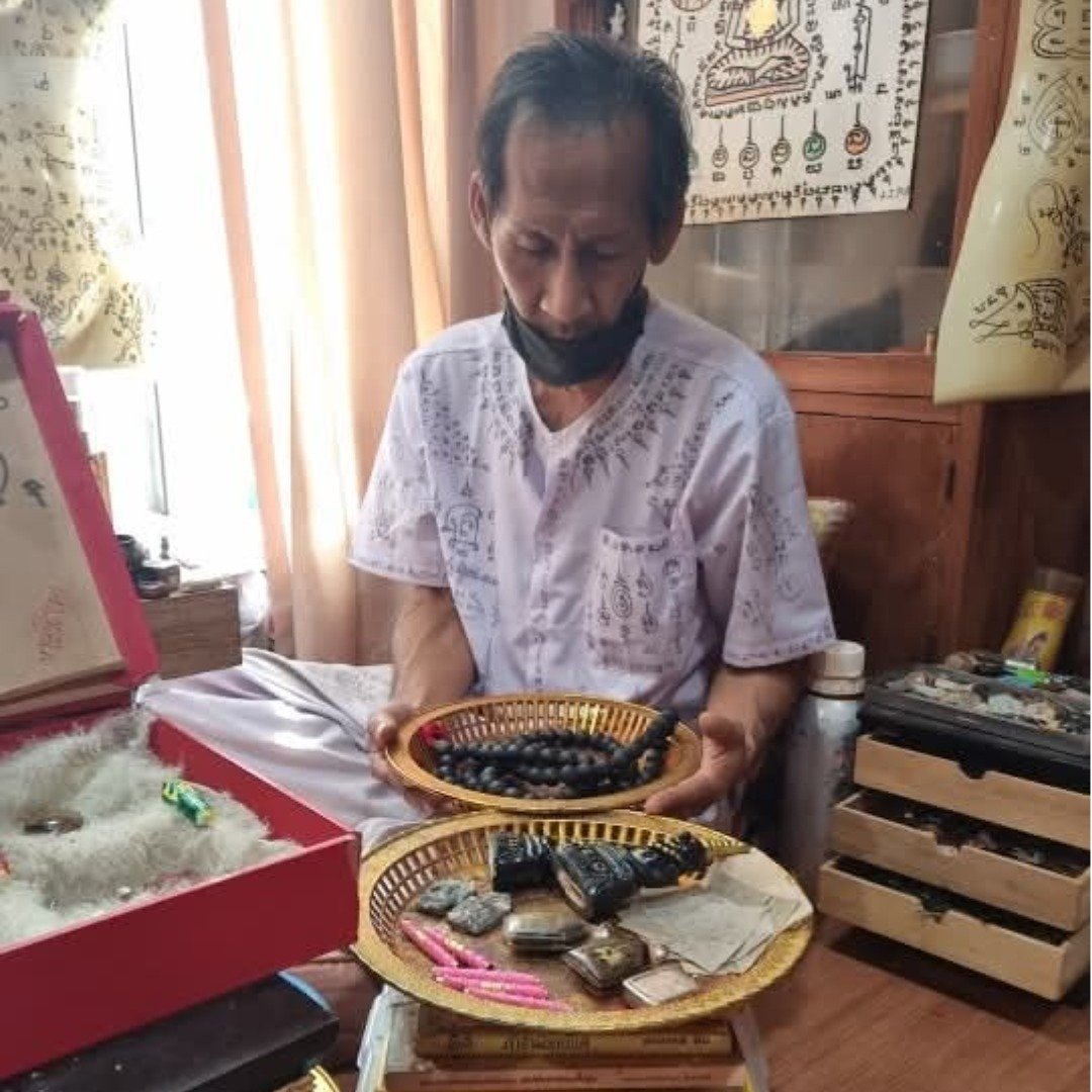 Old photograph showing the maker with amulets and ritual items during a consecration period