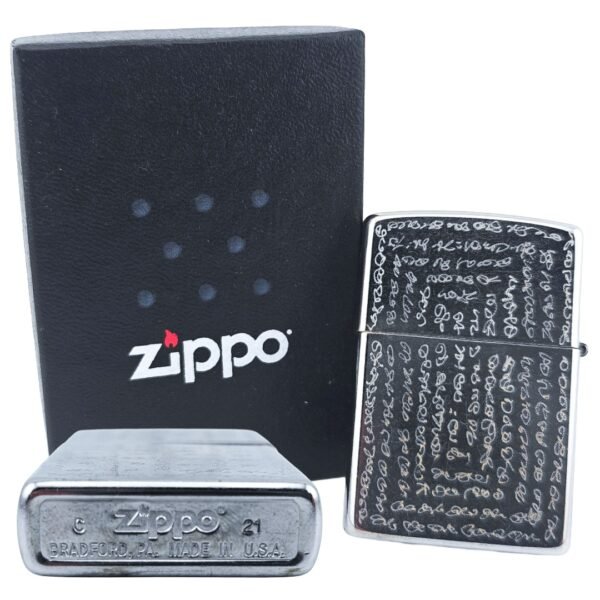 Hand engraved Thai yant genuine Zippo by Ajarn Kitkamo shown with original Zippo box and Bradford USA base stamp
