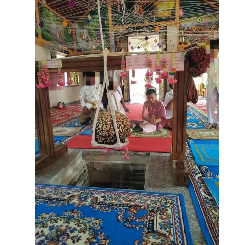 Luk Nimit stone ball suspended above the temple burial pit before being buried under the temple.