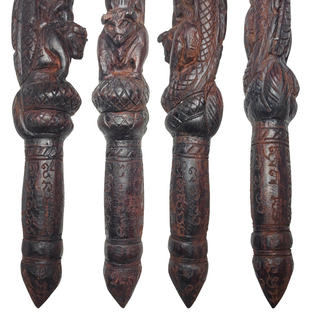 Close-up of the hand-engraved yants on the lower section of the Phaya Nak Mai Kru wooden wand.