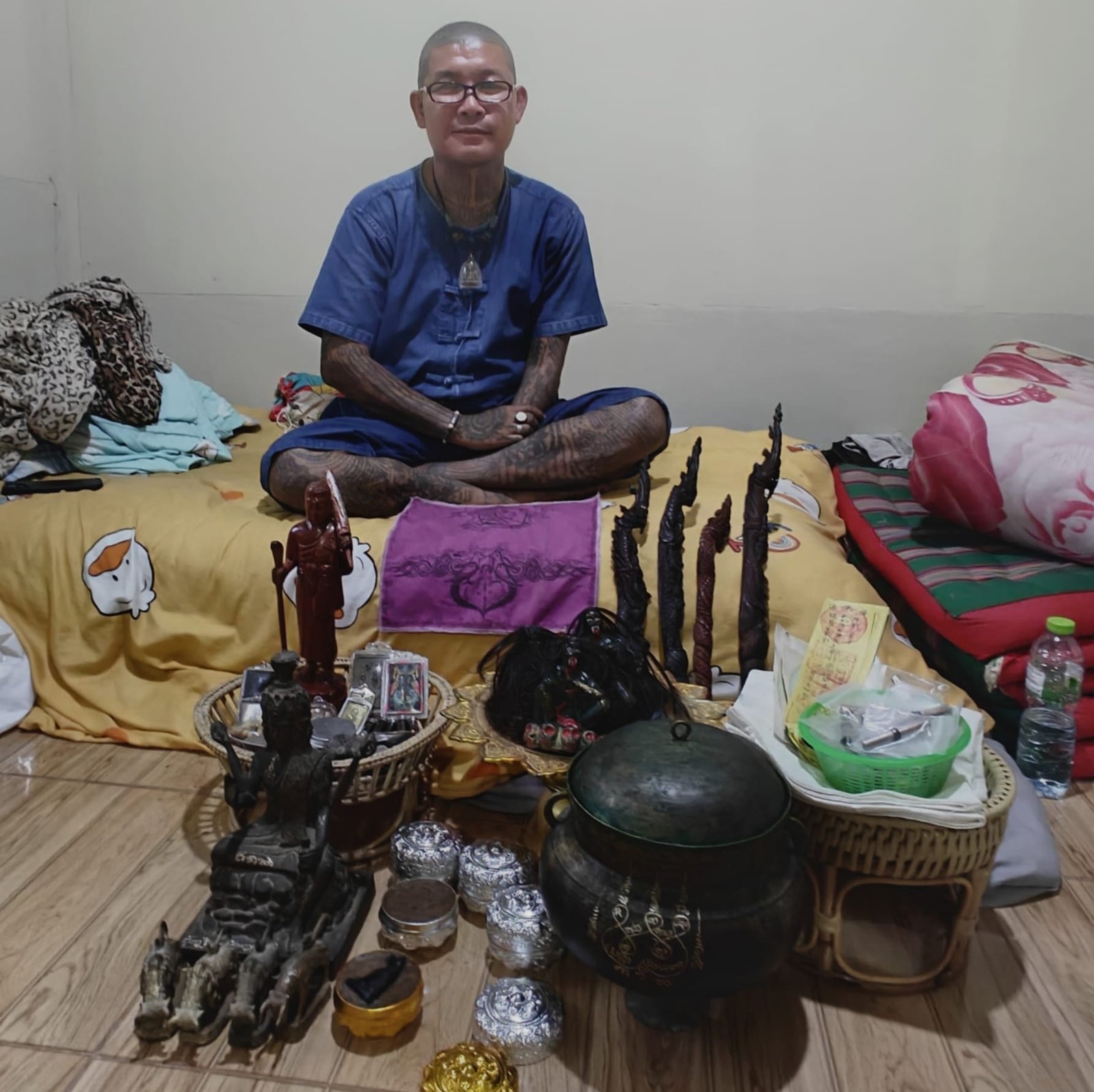Phu Lersi Pong with four Phaya Nak Mai Kru at his samnak, each slightly different in style and size.