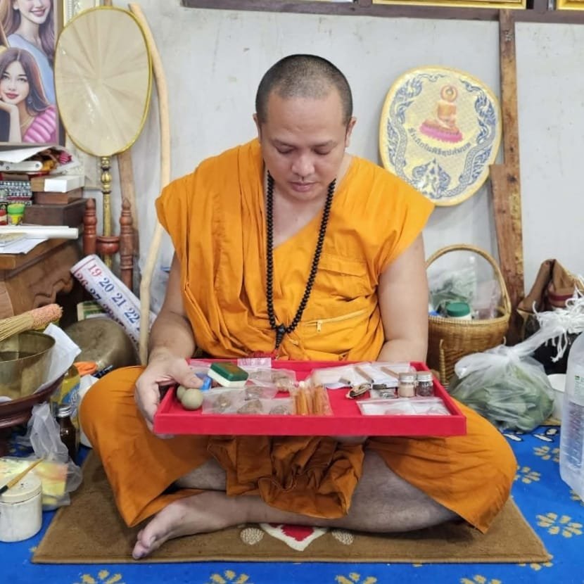 Kruba Chokchai with sacred items at Wat Nam Dib during the BE 2569 Takrut Maha Rangap release