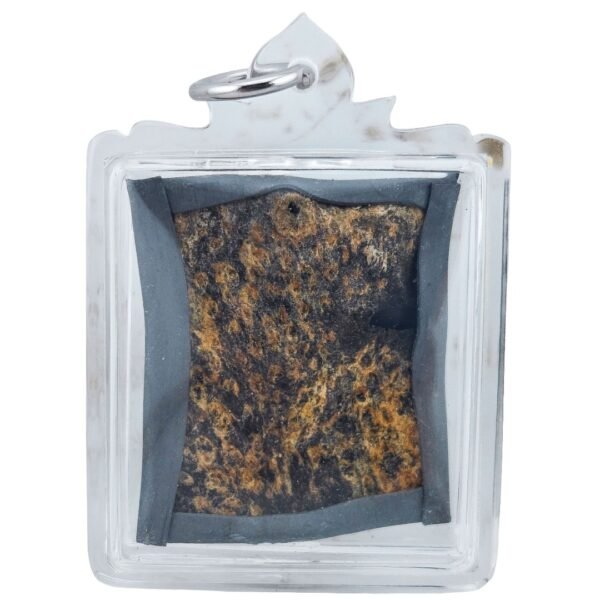Prai John Wicca amulet showing a dark brown textured surface with black edging, enclosed in a clear protective casing.