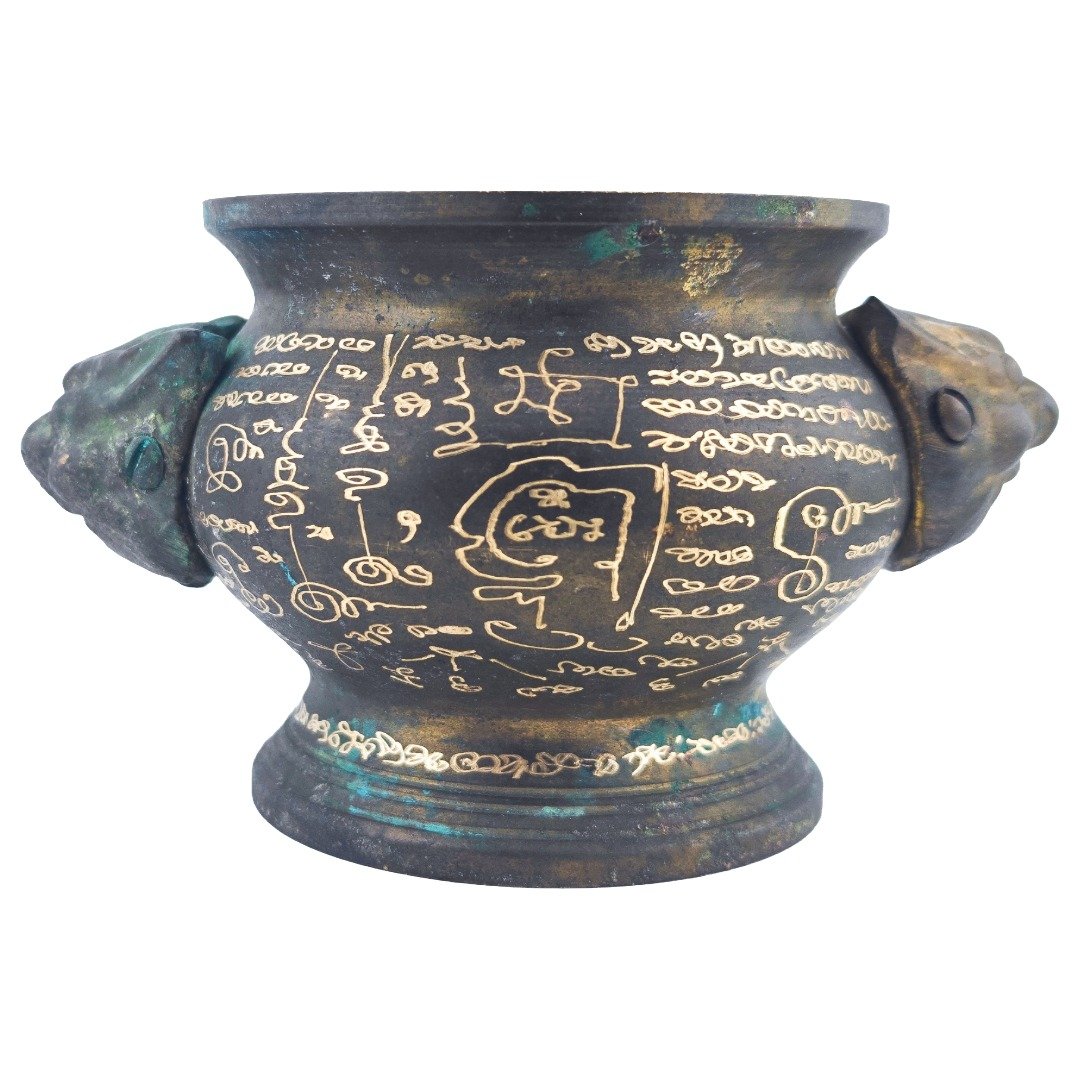 Full side view of the old samrit incense urn showing extensive hand-engraved yants between both handles