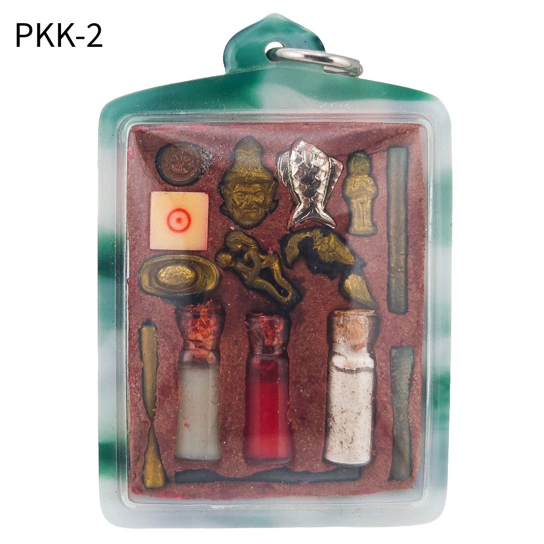 Back of Lersi Pu Kai Kaew PKK-2 amulet with miniature charms, wealth fish, ritual bottles, sacred powder and takruts in green casing.