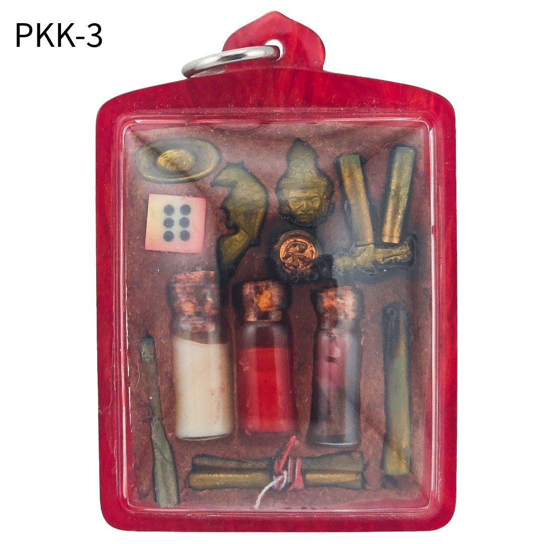 Back of Ajarn Wut's Lersi Pu Kai Kaew PKK-3 amulet, showing wealth dice, gold ingot, Salika bird, ritual bottles and takruts in red casing.