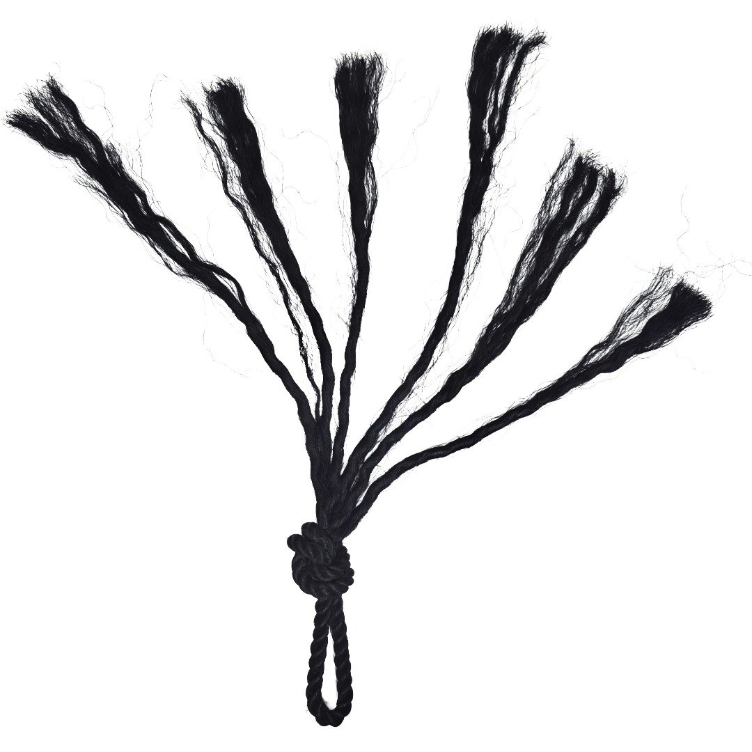 Full front view of Ajarn Kitkamo's Prai Command Whip showing its multi-tailed black rope strands, central knot and loop handle.