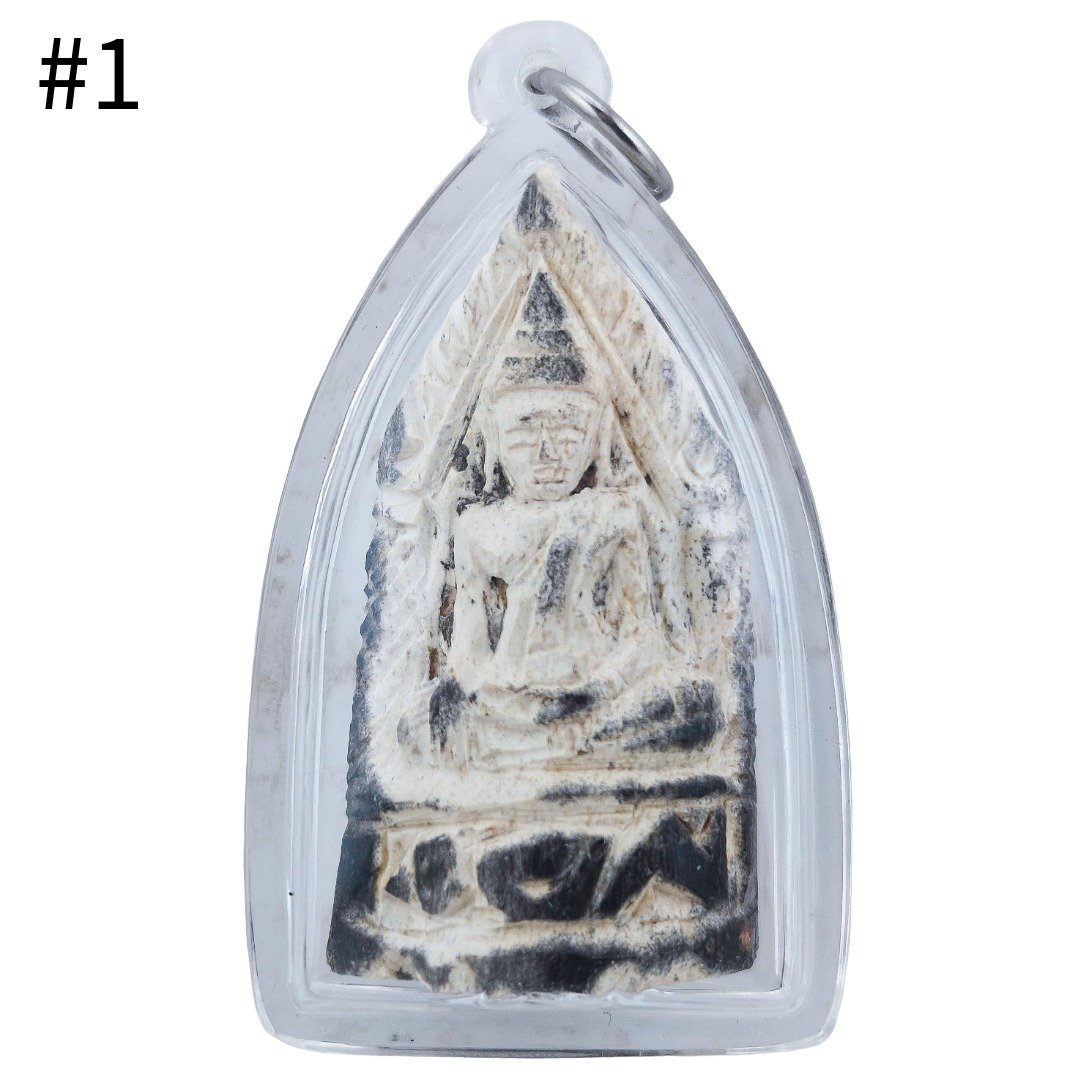 Front of Gradook Prai Khun Paen piece 1 showing the seated figure with pale textured relief and dark markings inside a clear casing