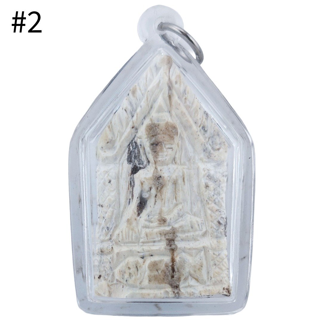 Front of Gradook Prai Khun Paen piece 2 showing the seated figure, pale textured surface and clear pendant casing