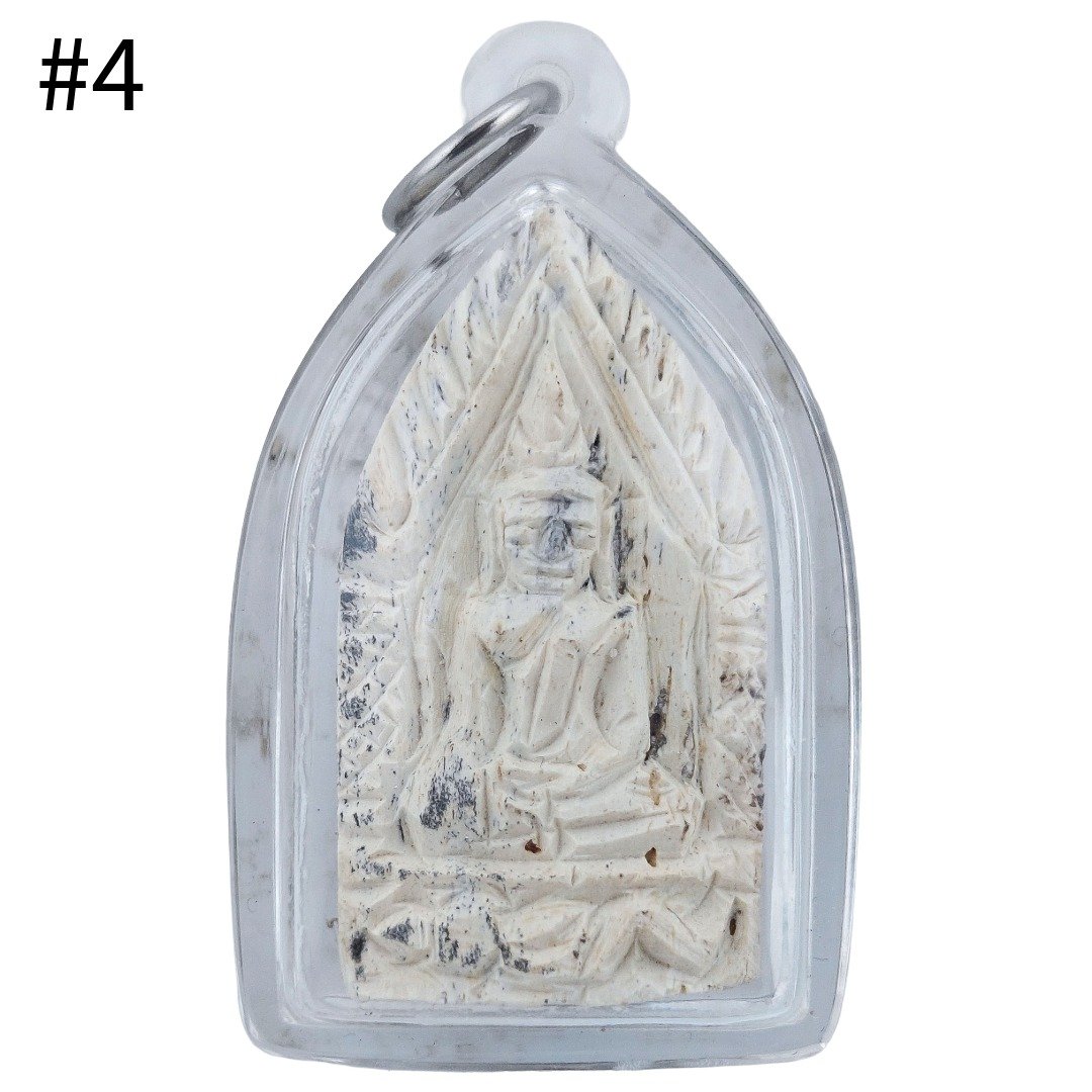 Front of Gradook Prai Khun Paen piece 4 showing a seated Khun Paen figure with pale carved details in a clear casing