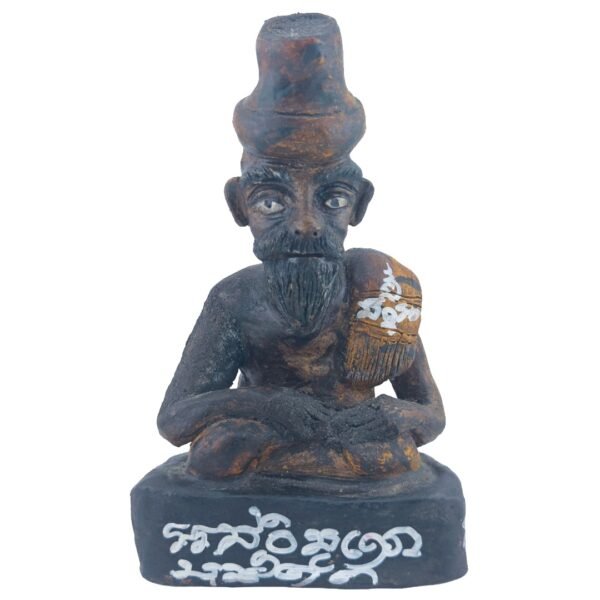 Front view of Ajarn Tom's old Lersi Sermingpai Bucha showing the bearded human-form ascetic seated cross-legged with white inscriptions on the base.