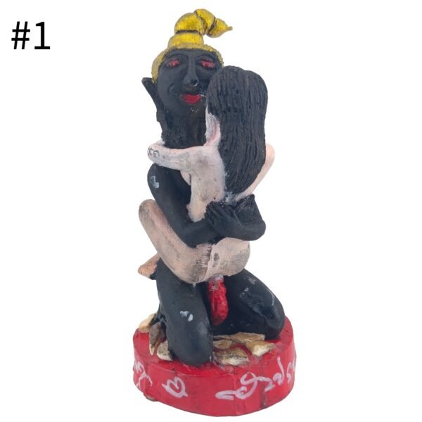 Front view of 400 Cemetery Ngan Bucha number 1 by Ajarn Tom, showing a black Ngan with gold hair and a pale female figure on a red base.