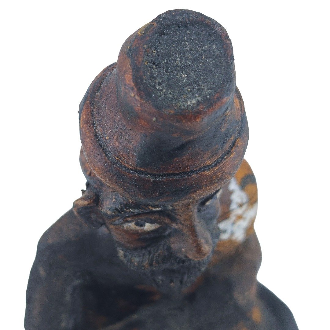 Close-up from above showing the aged head, hat, eyes and beard of Ajarn Tom's old Lersi Sermingpai Bucha.